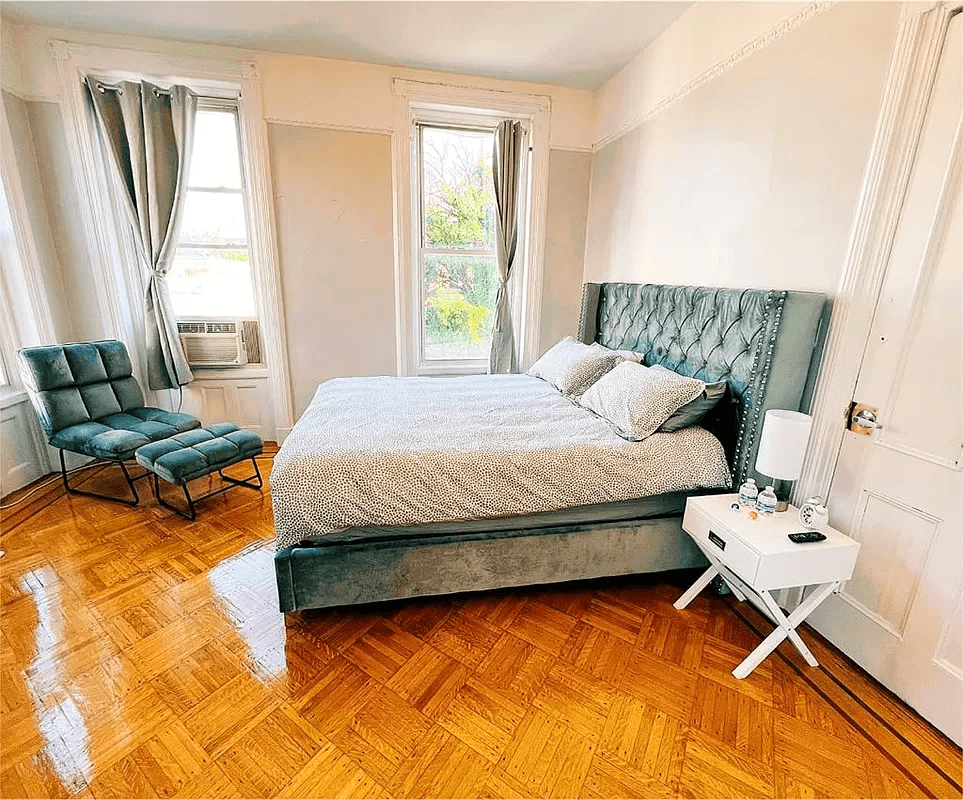 bedroom with three windows