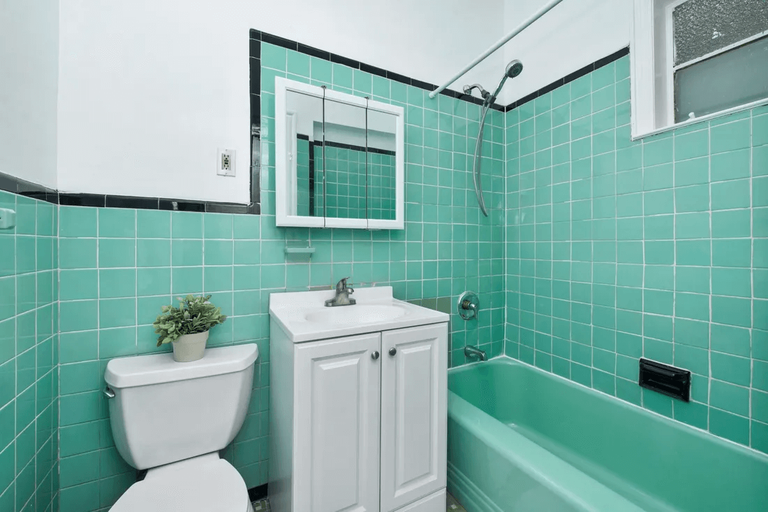 bathroom with vintage green tile and bath
