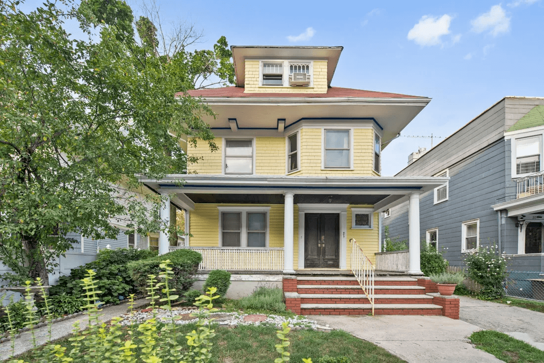 house exterior with yellow clapboard and front porch