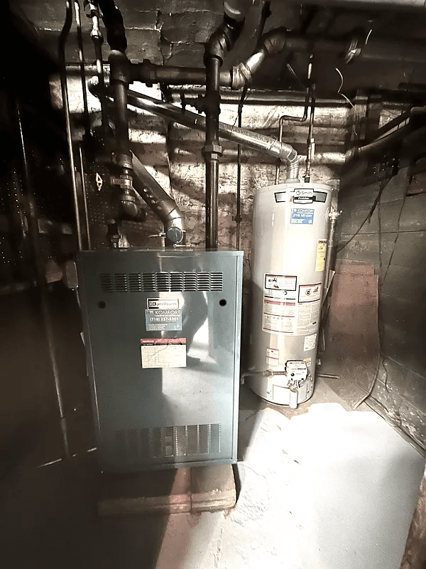 view of furnace and hot water heater