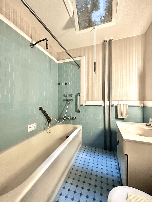 bathroom with green wall tile