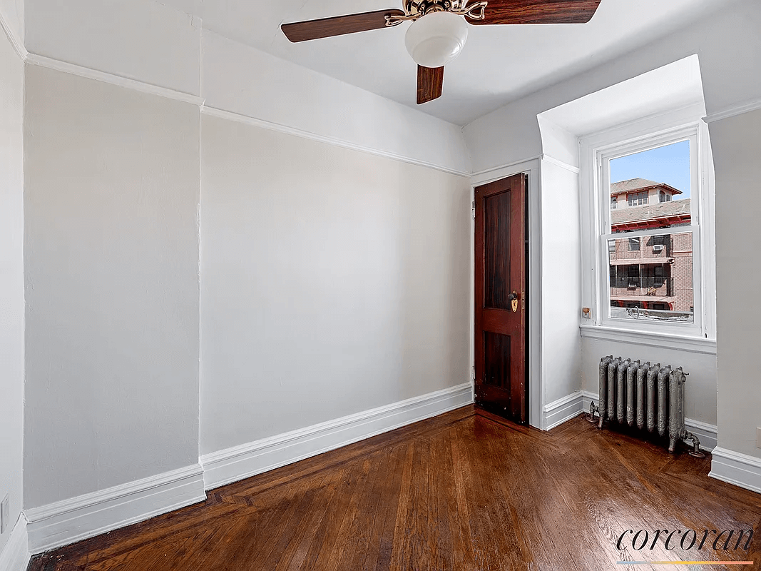 bedroom with wood floors and ceiling fan