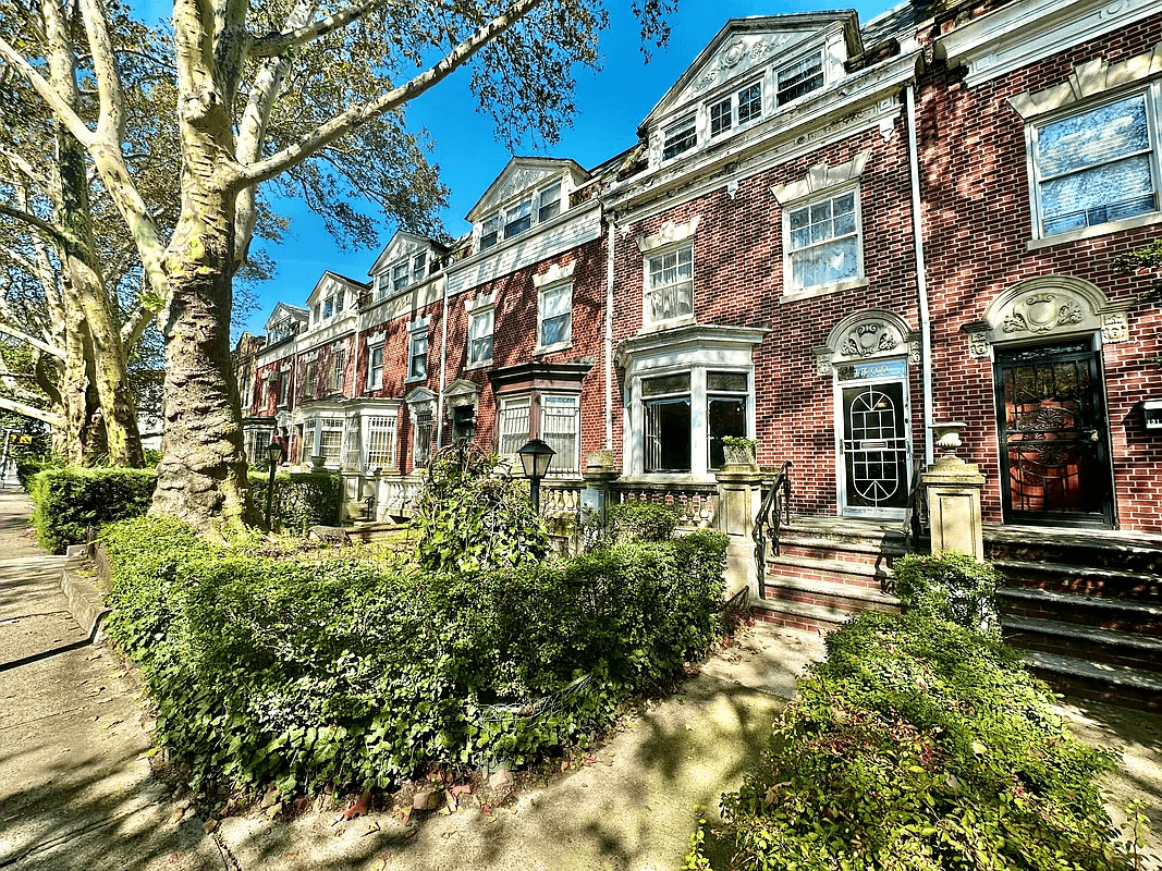 crown heights - street view of the red brick house and its matching neighbors