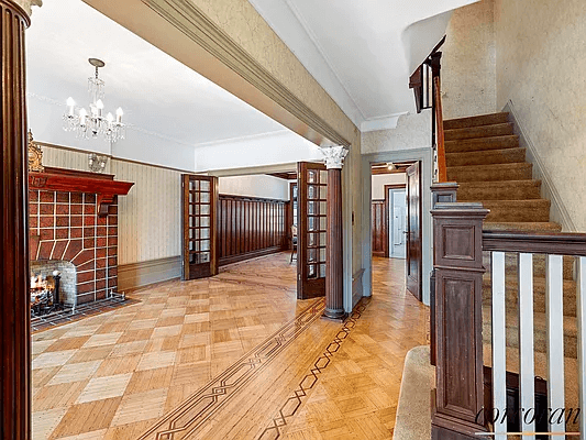 view from entry into front parlor with mantel