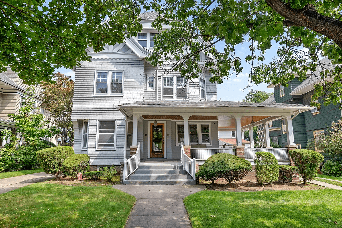 shingled exterior with wraparound porch