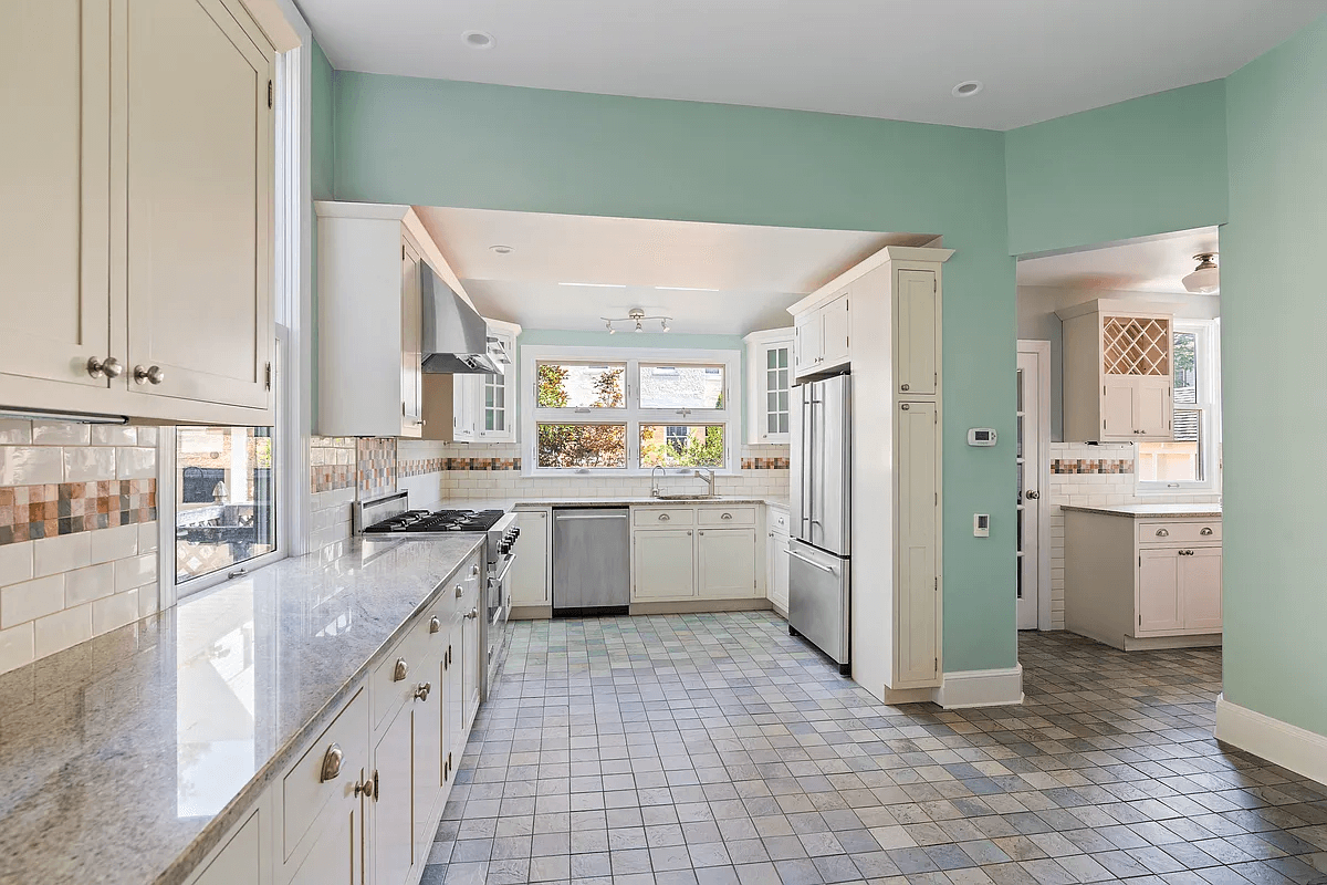 kitchen with white cabinets and view of butlers pantry