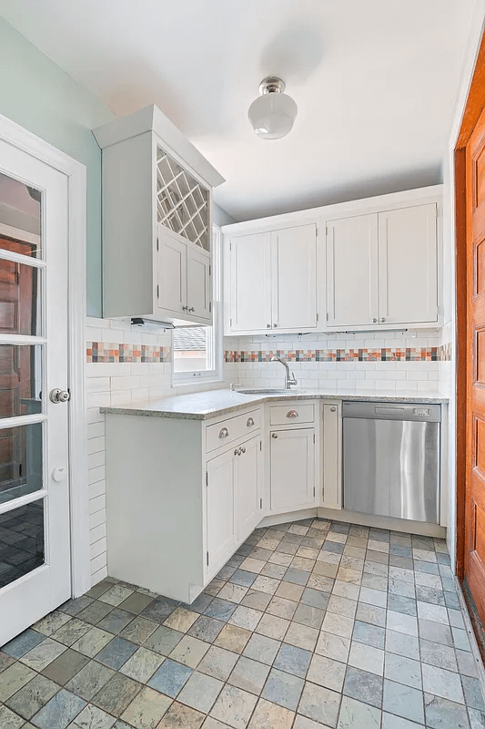 butlers pantry with corner sink and dishwasher