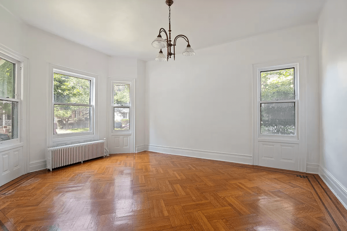 parlor with two exposures and wood floor with inlaind border