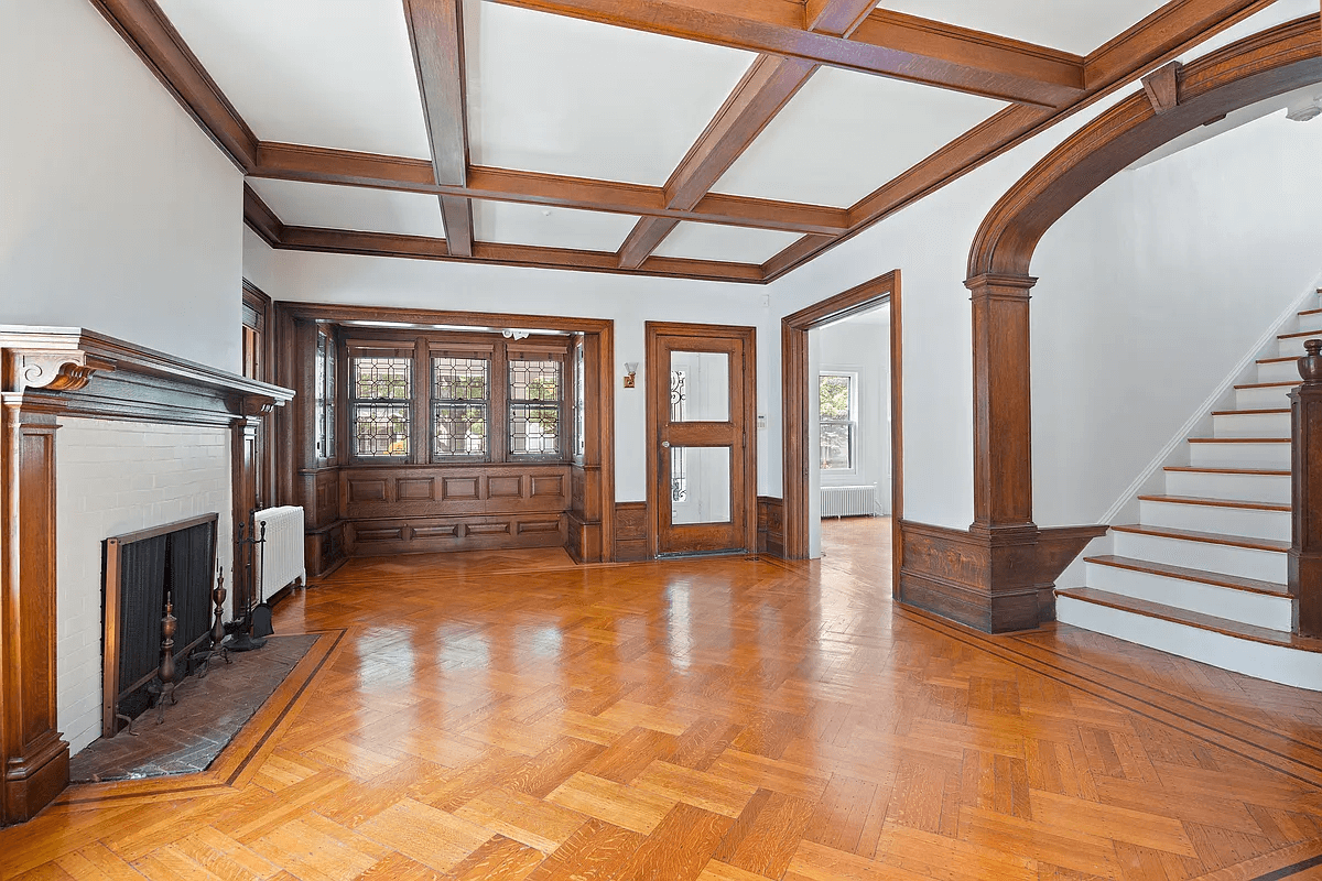 entry with mantel, coffered ceiling and nook