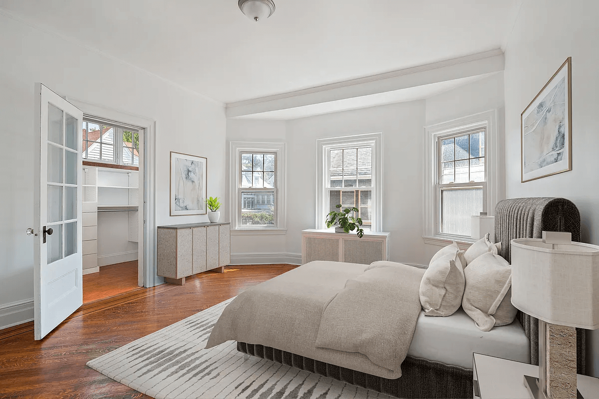 virtually staged bedroom showing walk-in closet