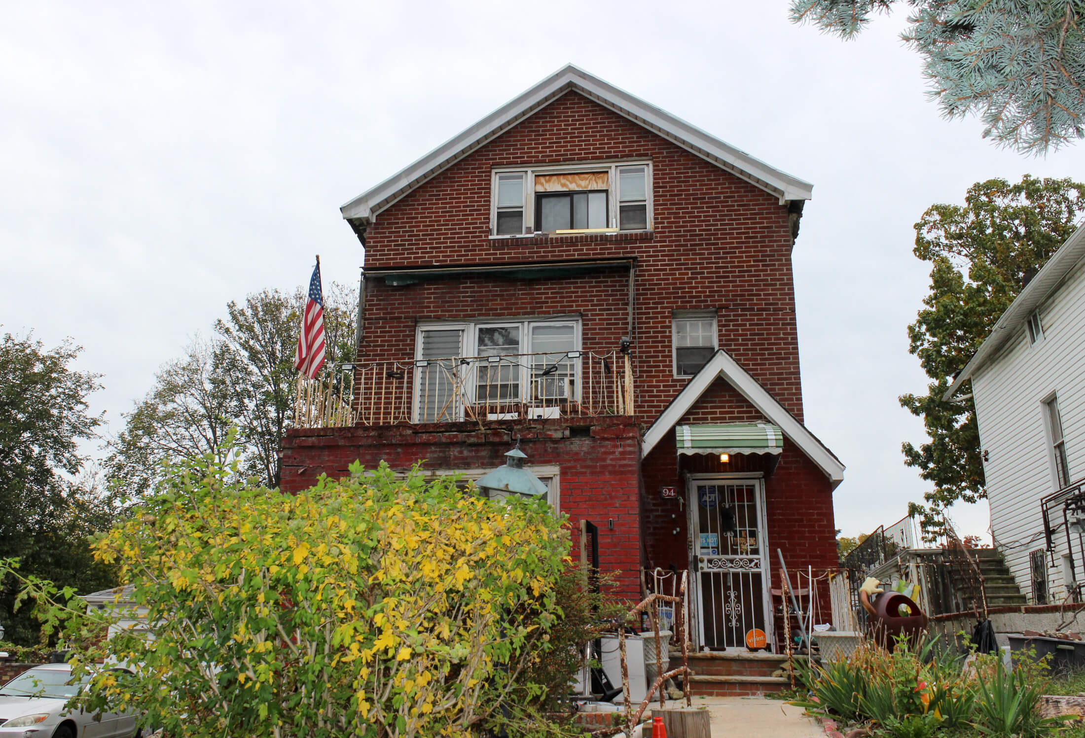 front gable house with an american flag