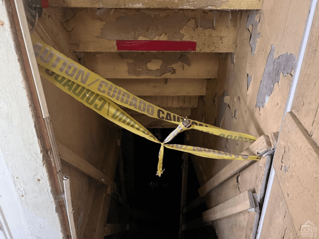 caution tape blocking the cellar doors