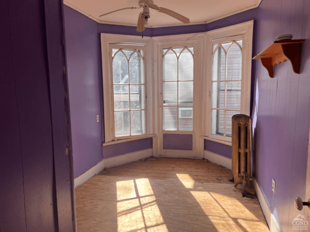 bedroom with bay window with gothic details