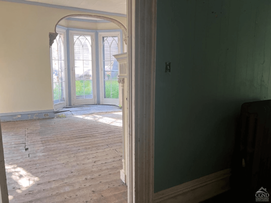 view into parlor showing the windowed niche