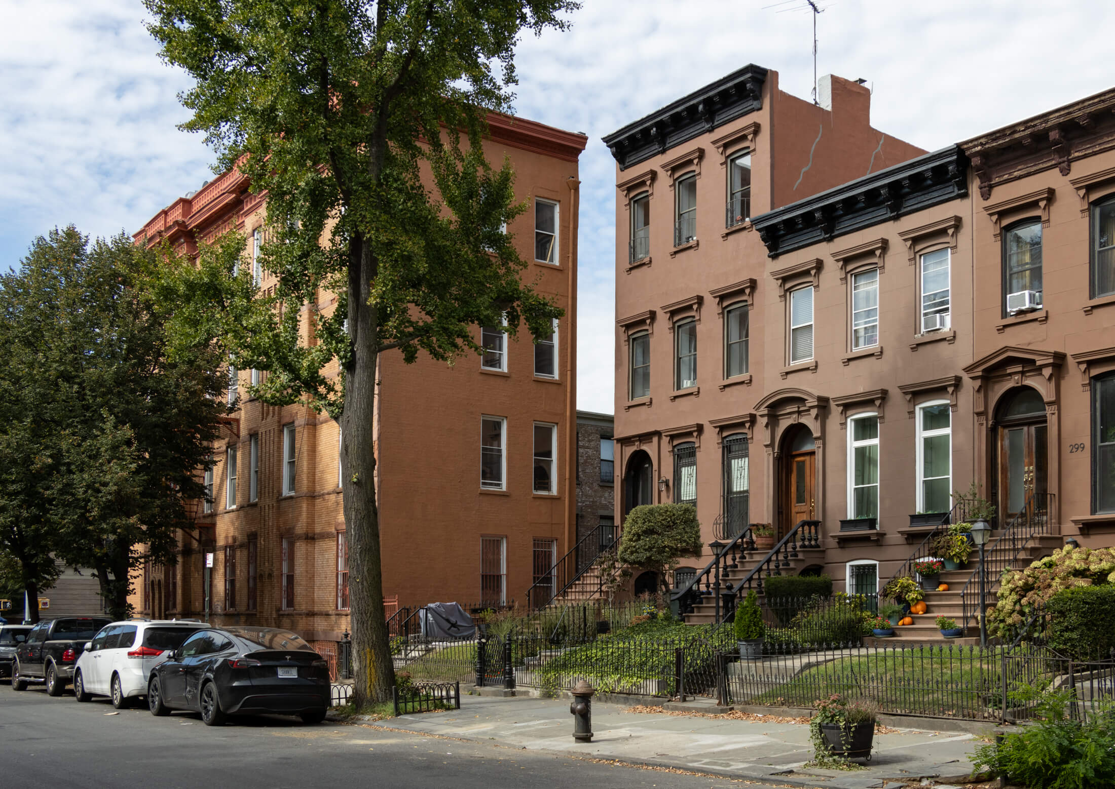 three story brownstone with a stoop and a bracketed cornice