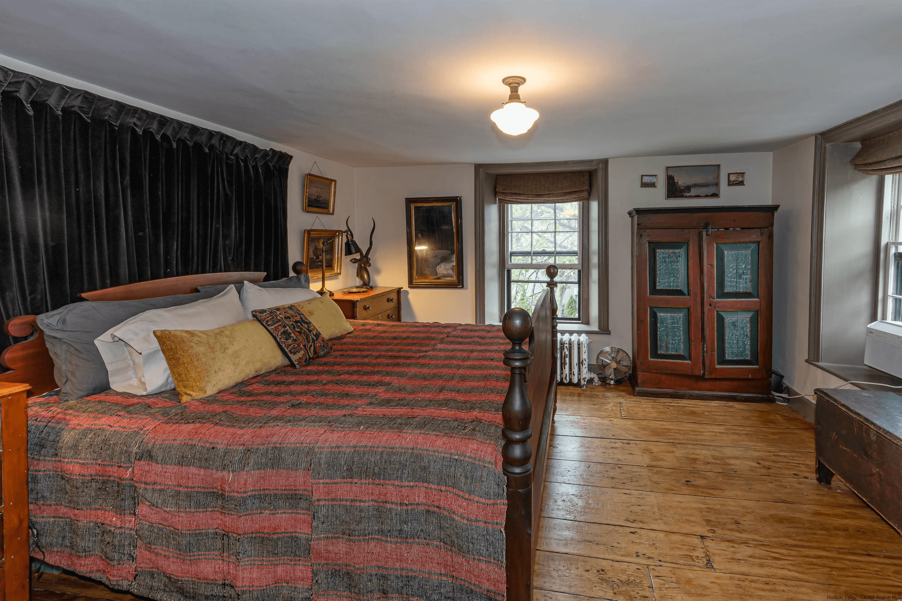 bedroom with wide planked floor boards