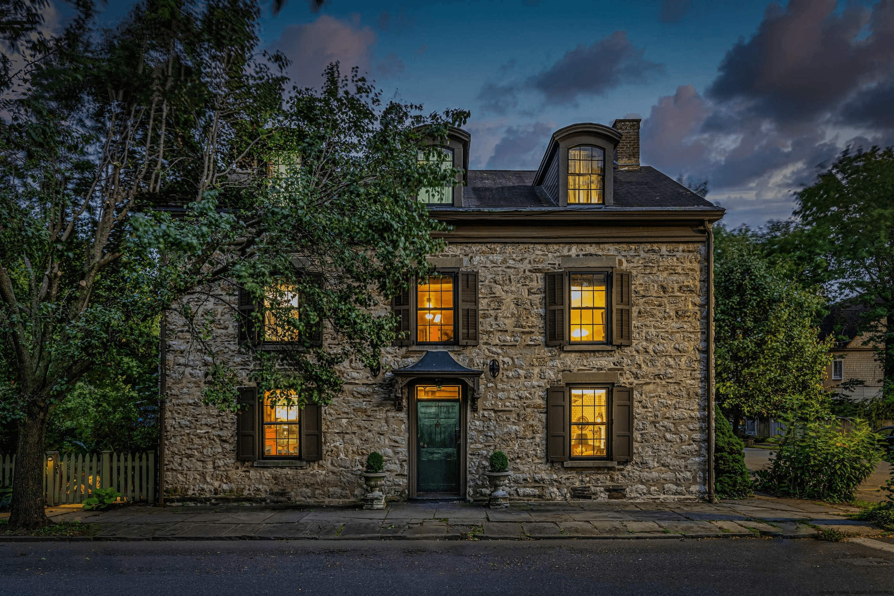 KINGSTON - Stone house illuminated at night