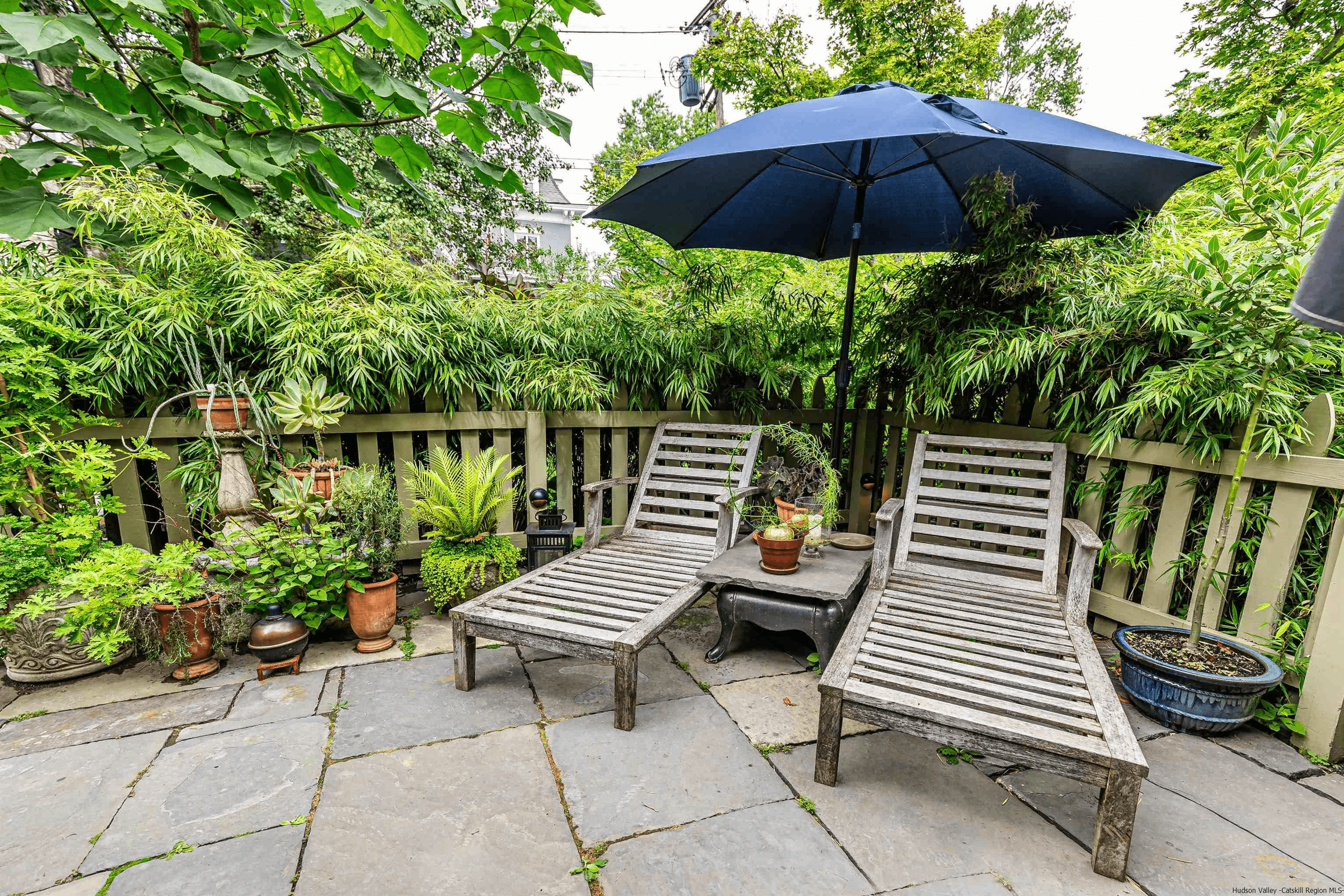 patio in the garden with room for seating and planters