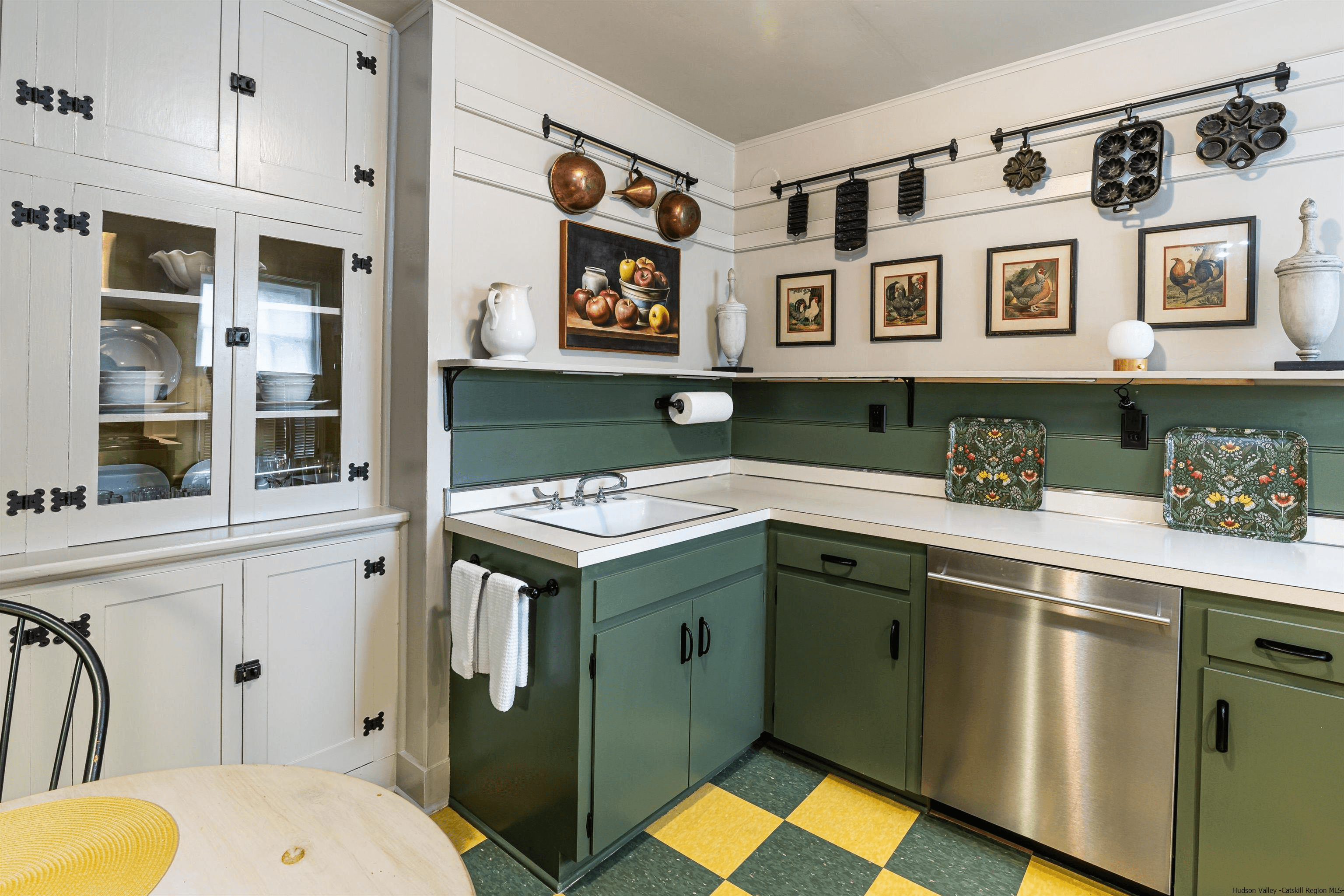kitchen on the lower level with with green and yellow checkerboard floor 