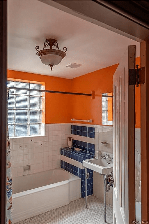 bathroom with deco era tub and sink