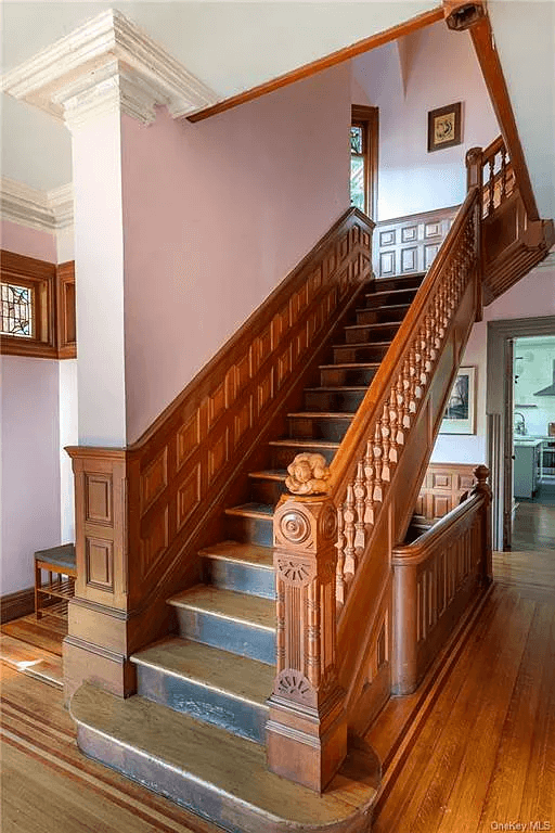 soriginal wooden staircase with wainscoting