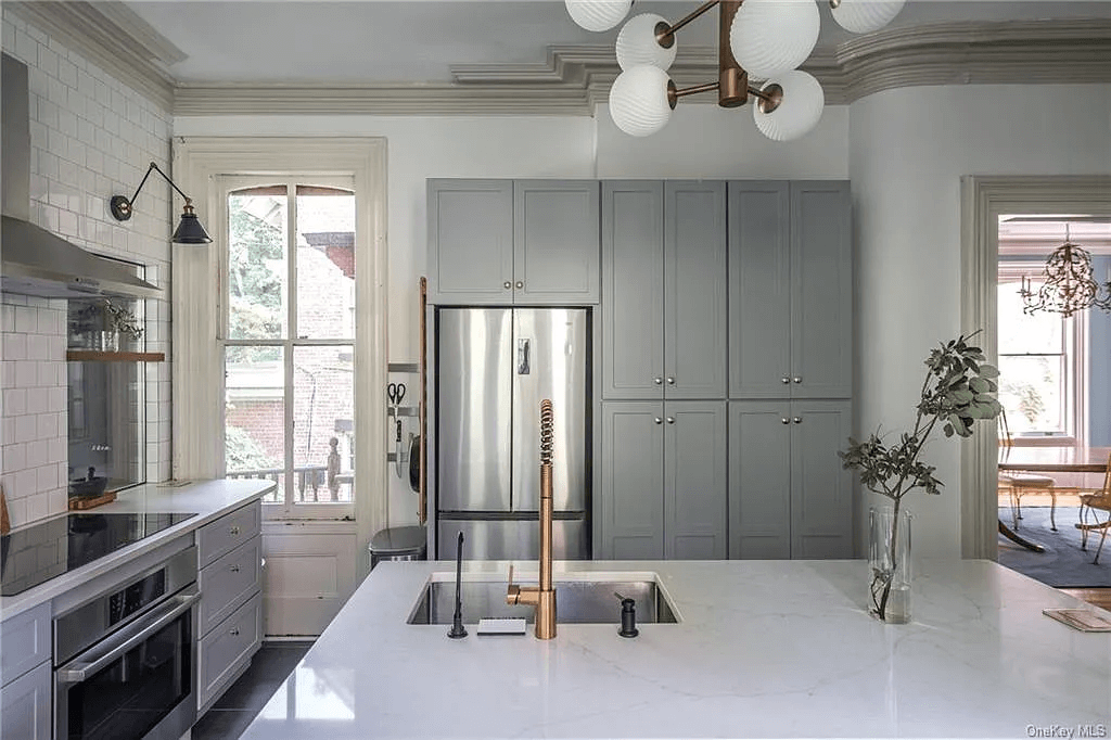 renovated kitchen with large white island