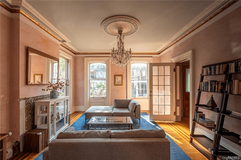 parlor with ceiling medallion, moldings and missing mantel