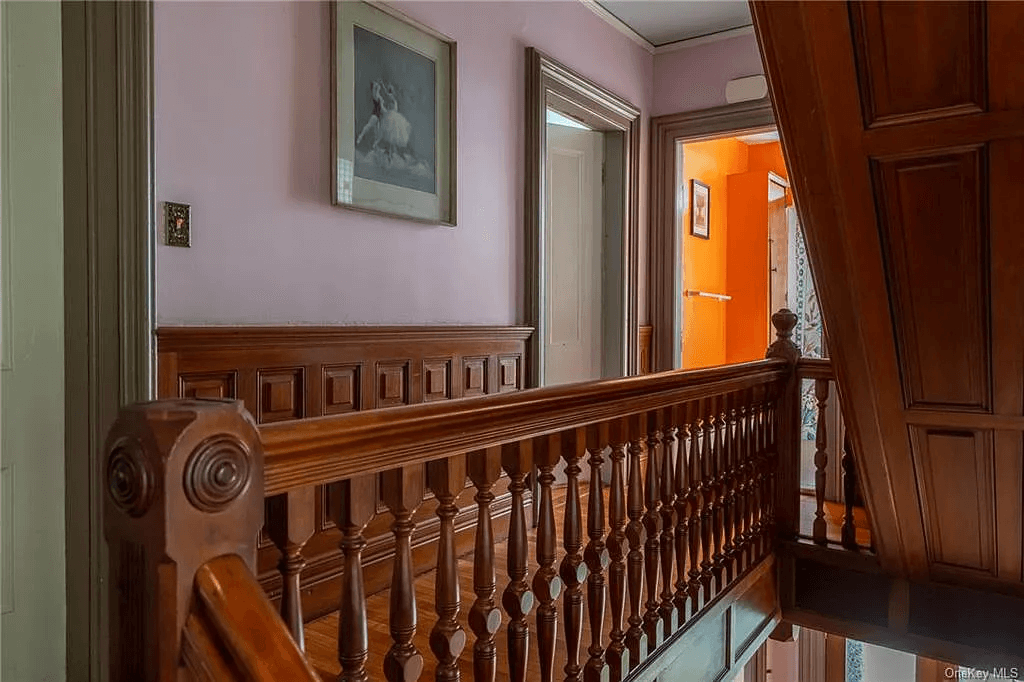 hall with stair and wainscoting