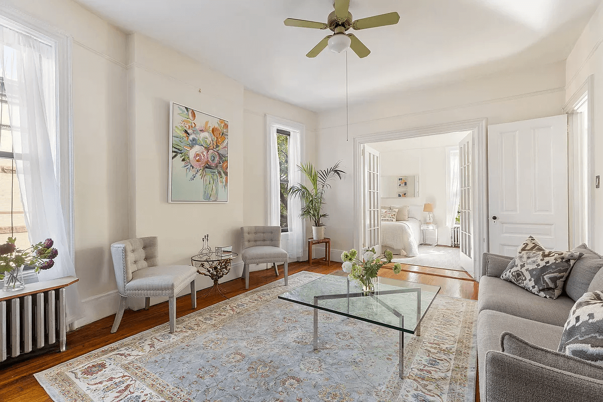 park slope co-op - living room with french doors to a bedroom room