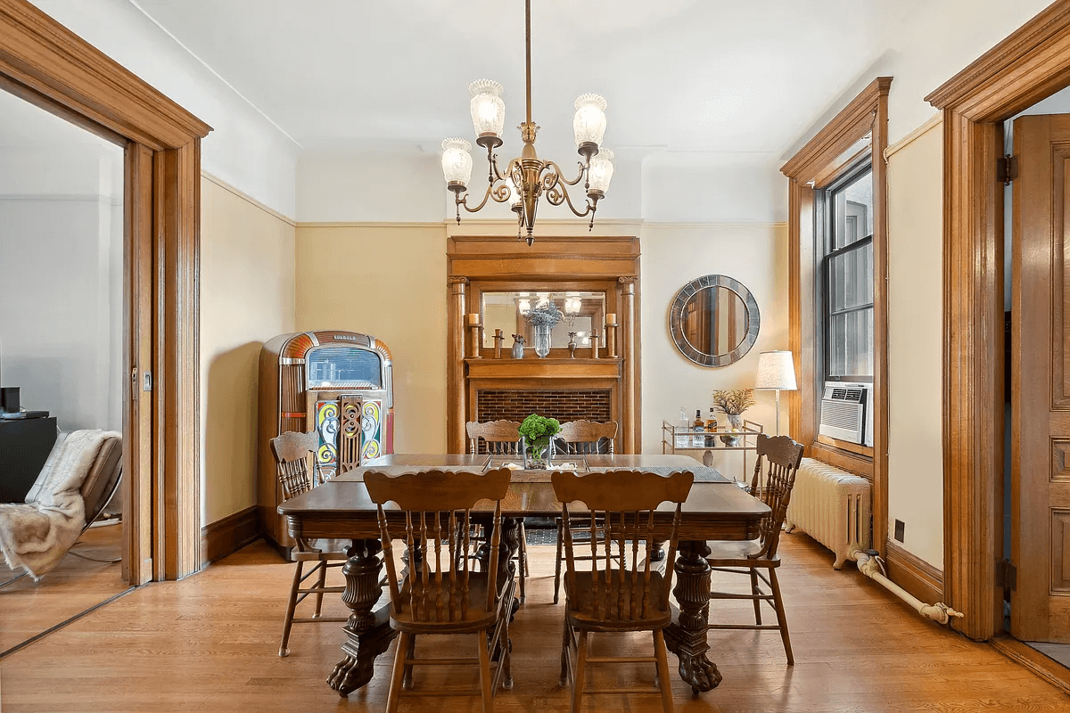 dining room with wooden mantel and door moldings