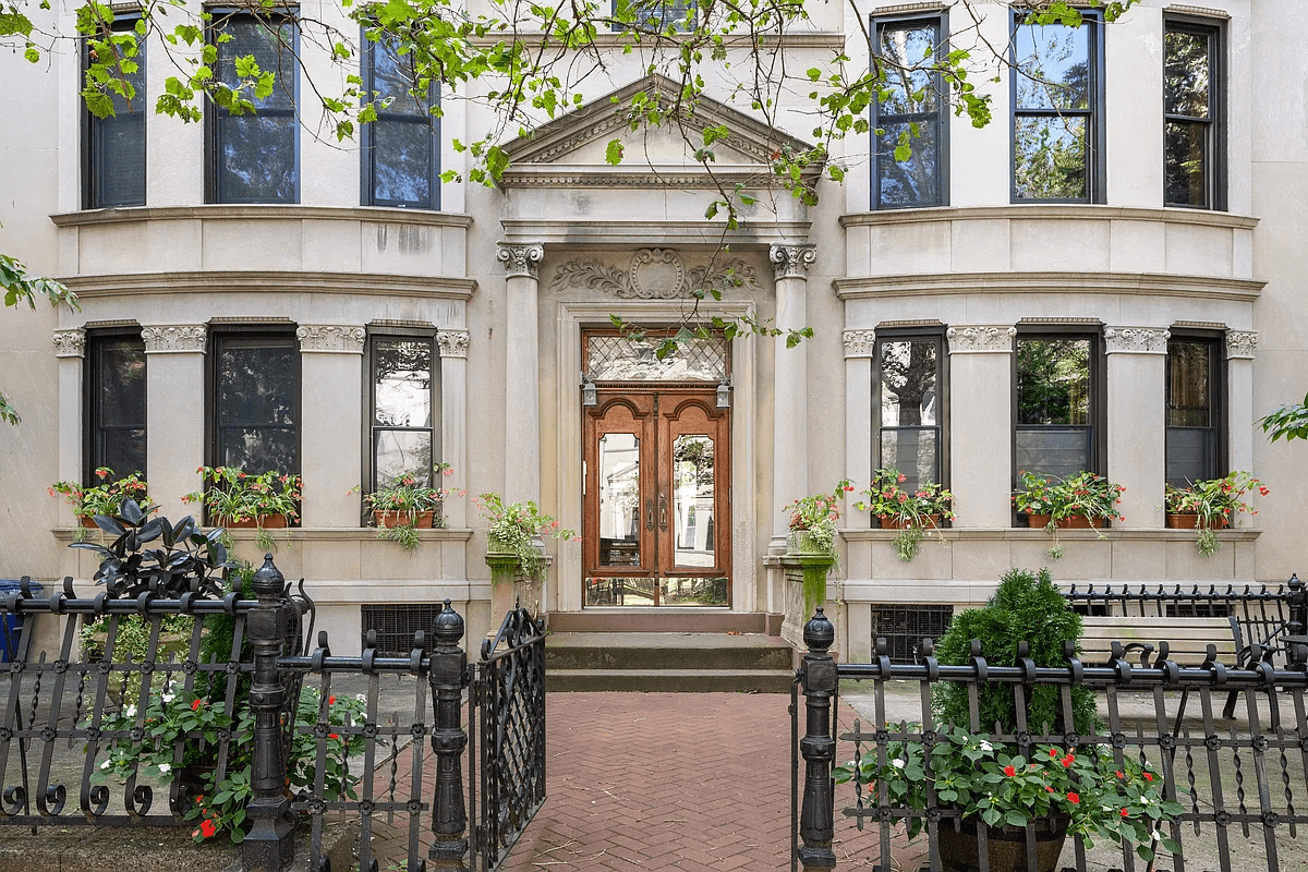 entrance to the stone building with a columned door surround