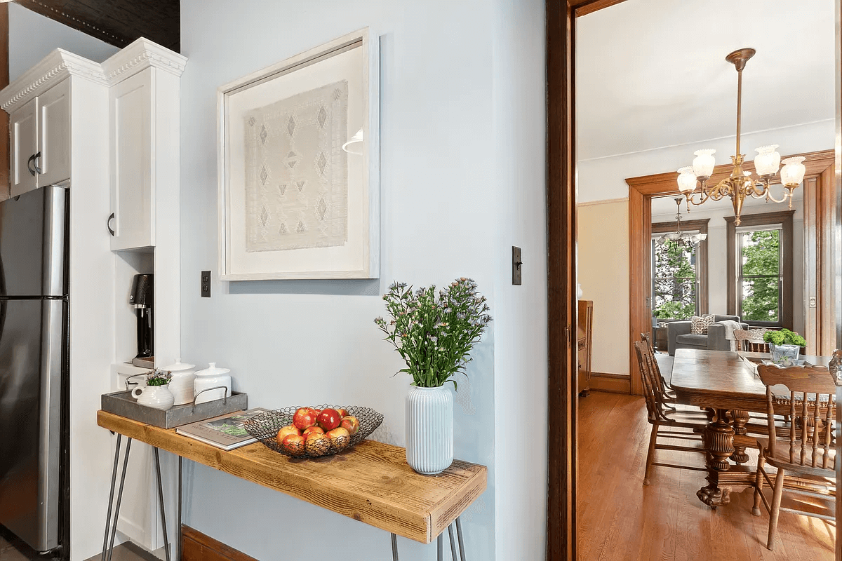 view of cabinets around fridge in the kitchen with view into dining room