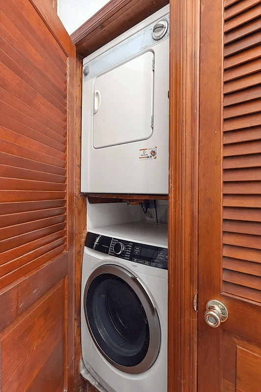 stacked washer and dryer in a closet
