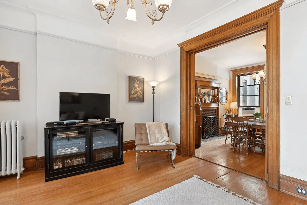 view from living room into dining room with wood floors in both rooms