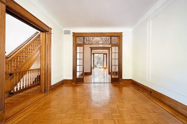 brooklyn open house - parlor with wood floor and fretwork screen