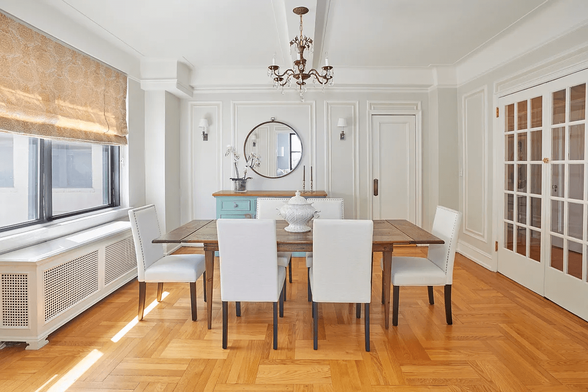 dining room with wall moldings and wood floor