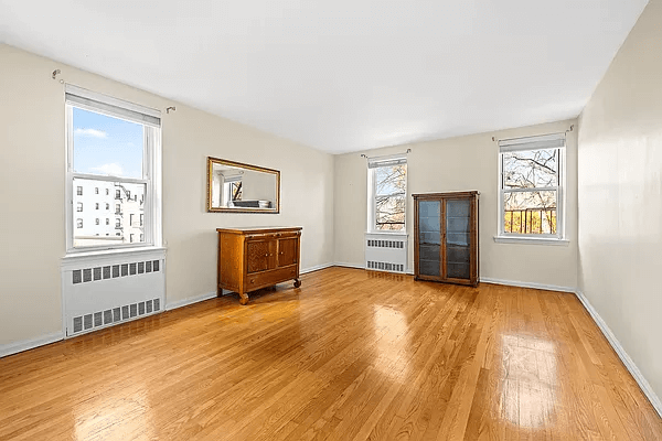 living room with wood floor and two exposures