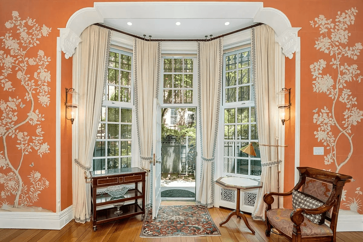 bay in dining room with a center door leading to the garden