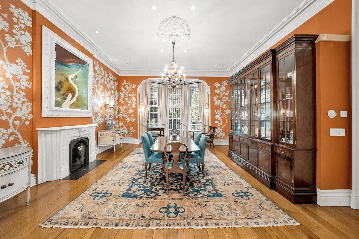 dining room with orange wall covering