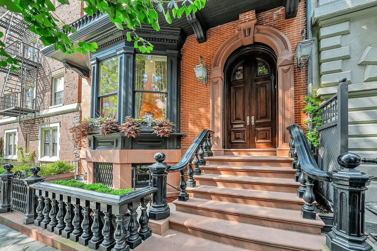 front door with arched brownstone trim