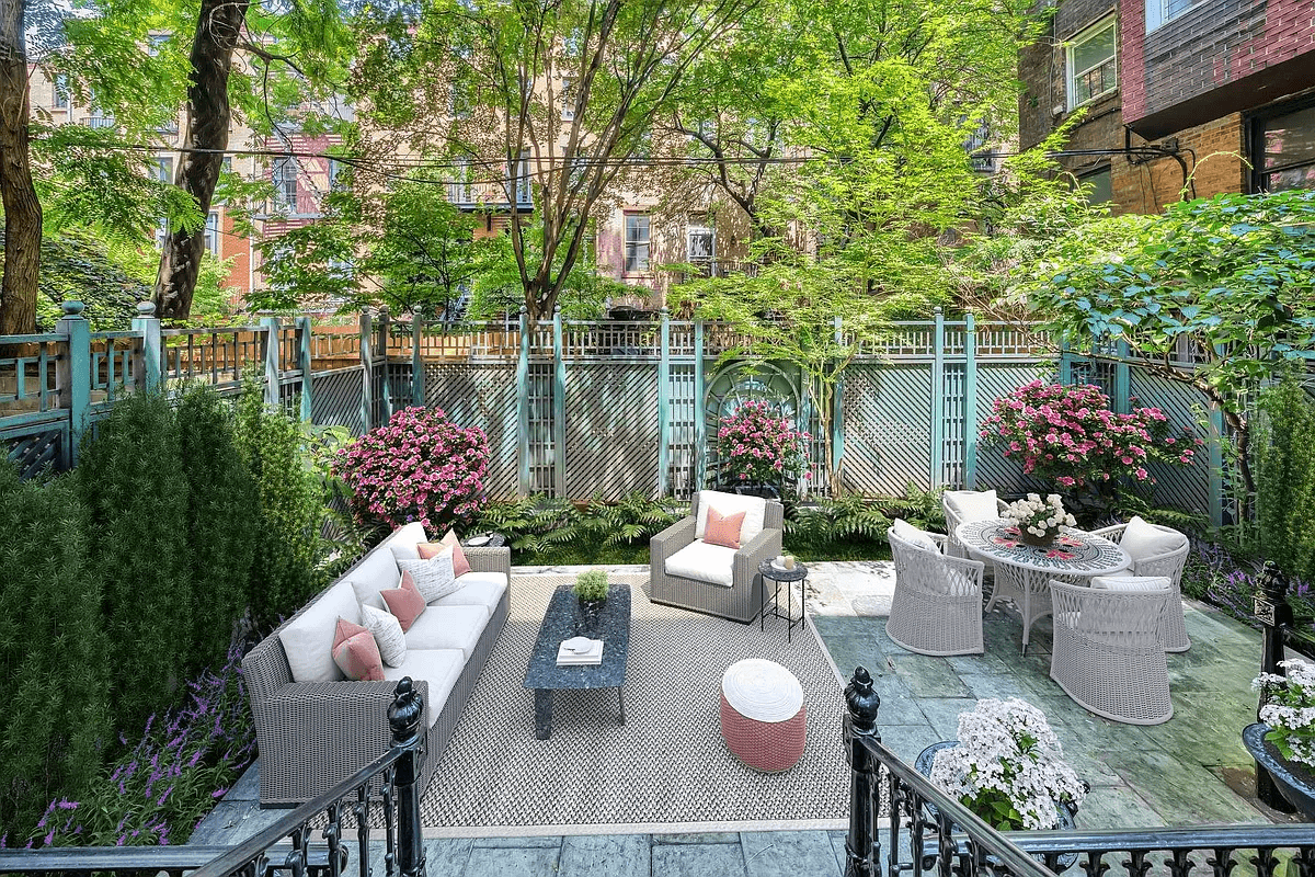 virtually staged rear yard with dining and seating areas