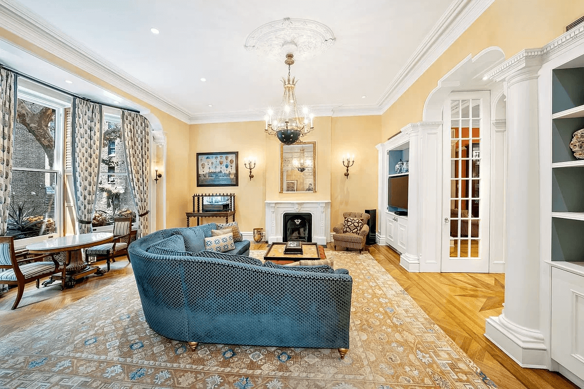 parlor with recessed lights and modern built-ins with shelves