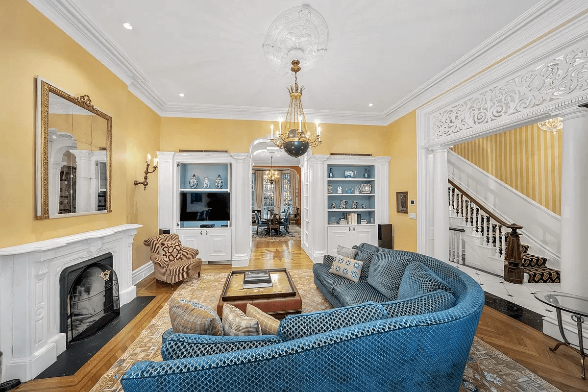 parlor with mantel and modern built-ins