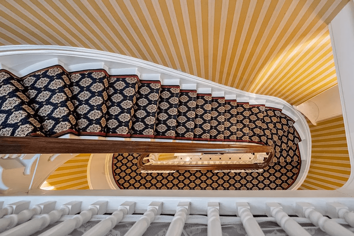 view looking down at the curved stair