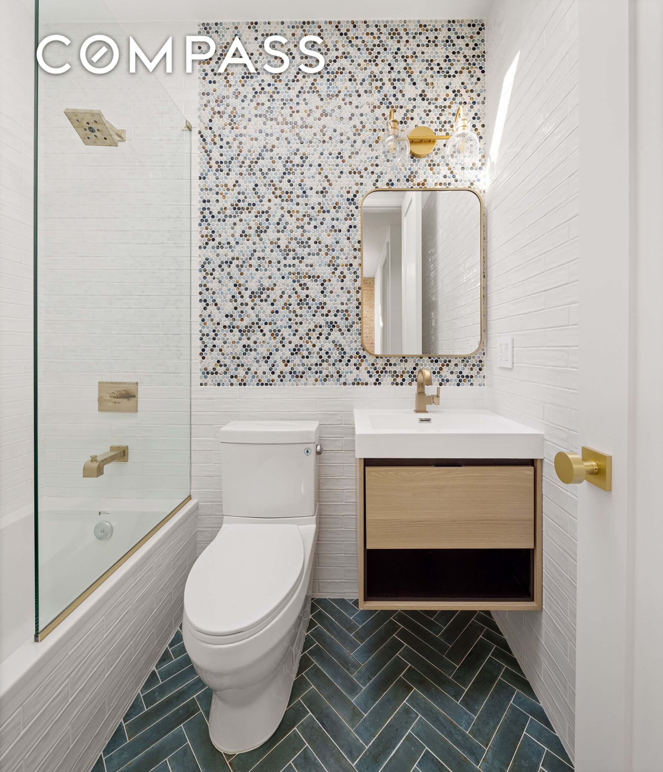 bathroom with white fixtures and floating vanity