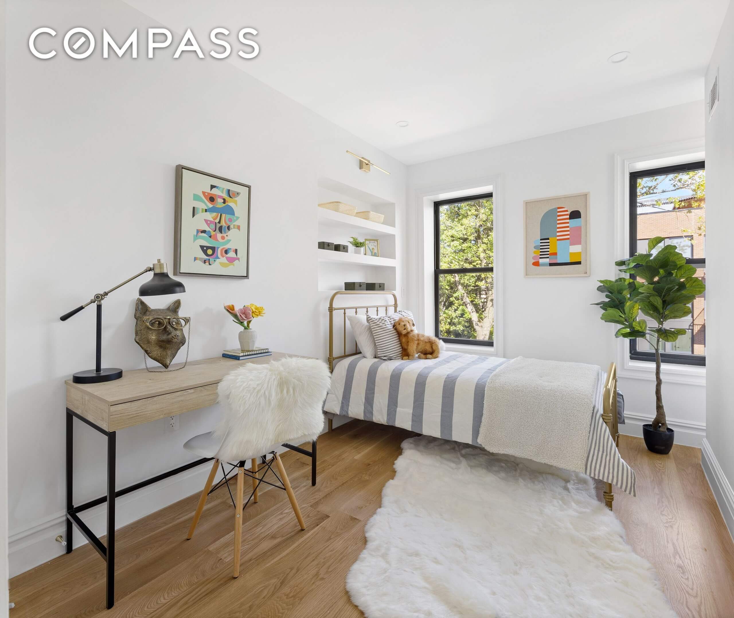 bedroom with white walls and two windows