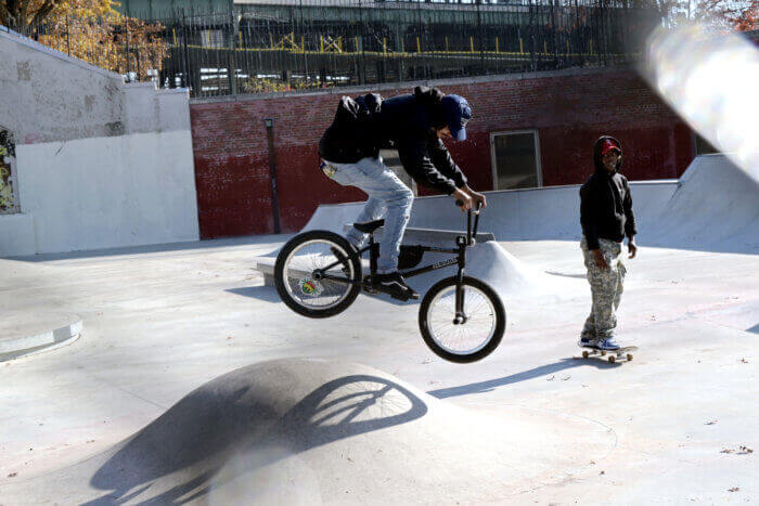 biker and skateboarder in the park