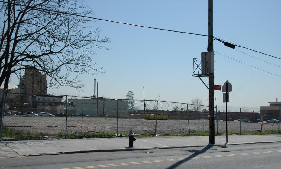 empty lot behind a chain link fence