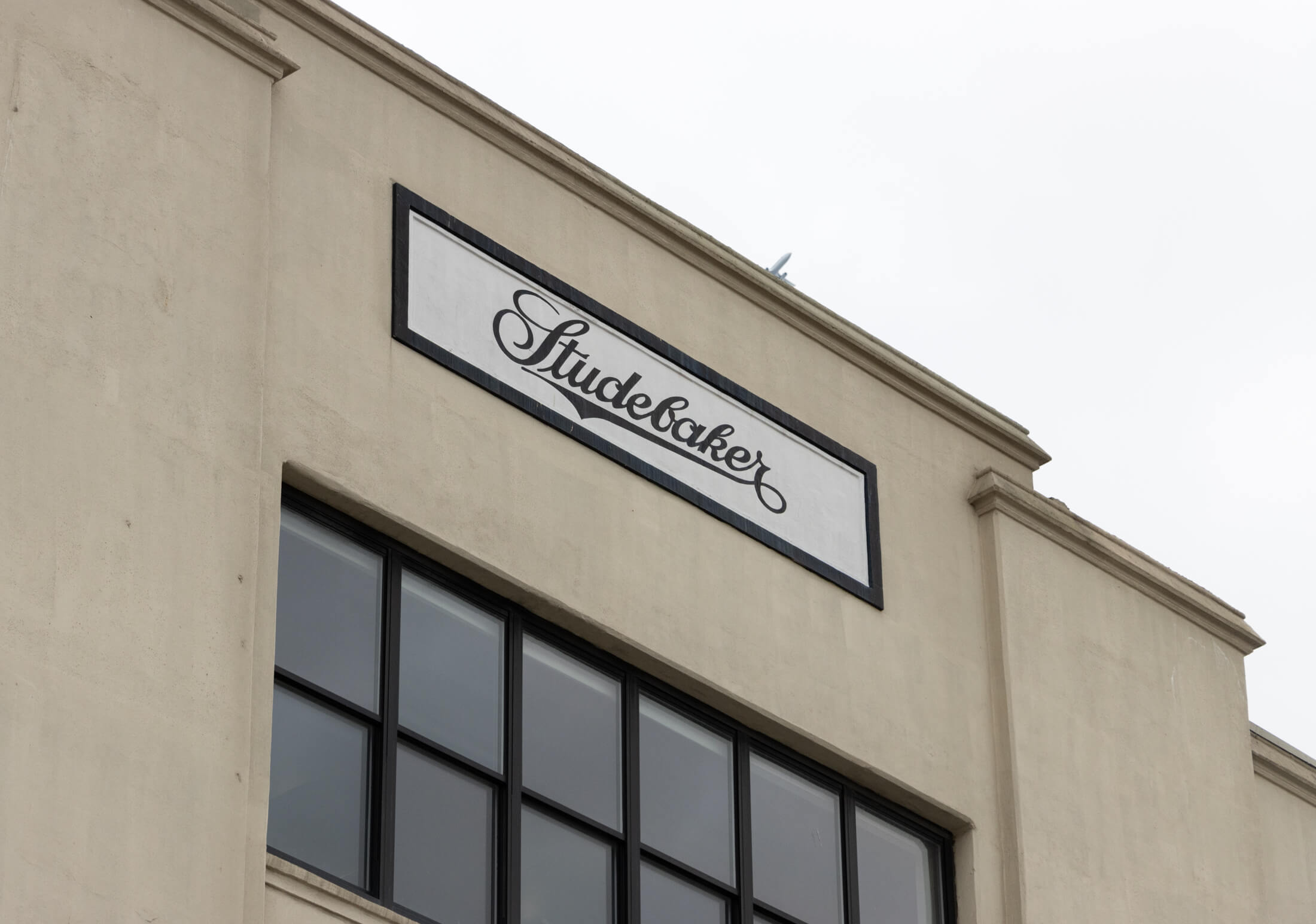 sutdebaker sign on the top of the building