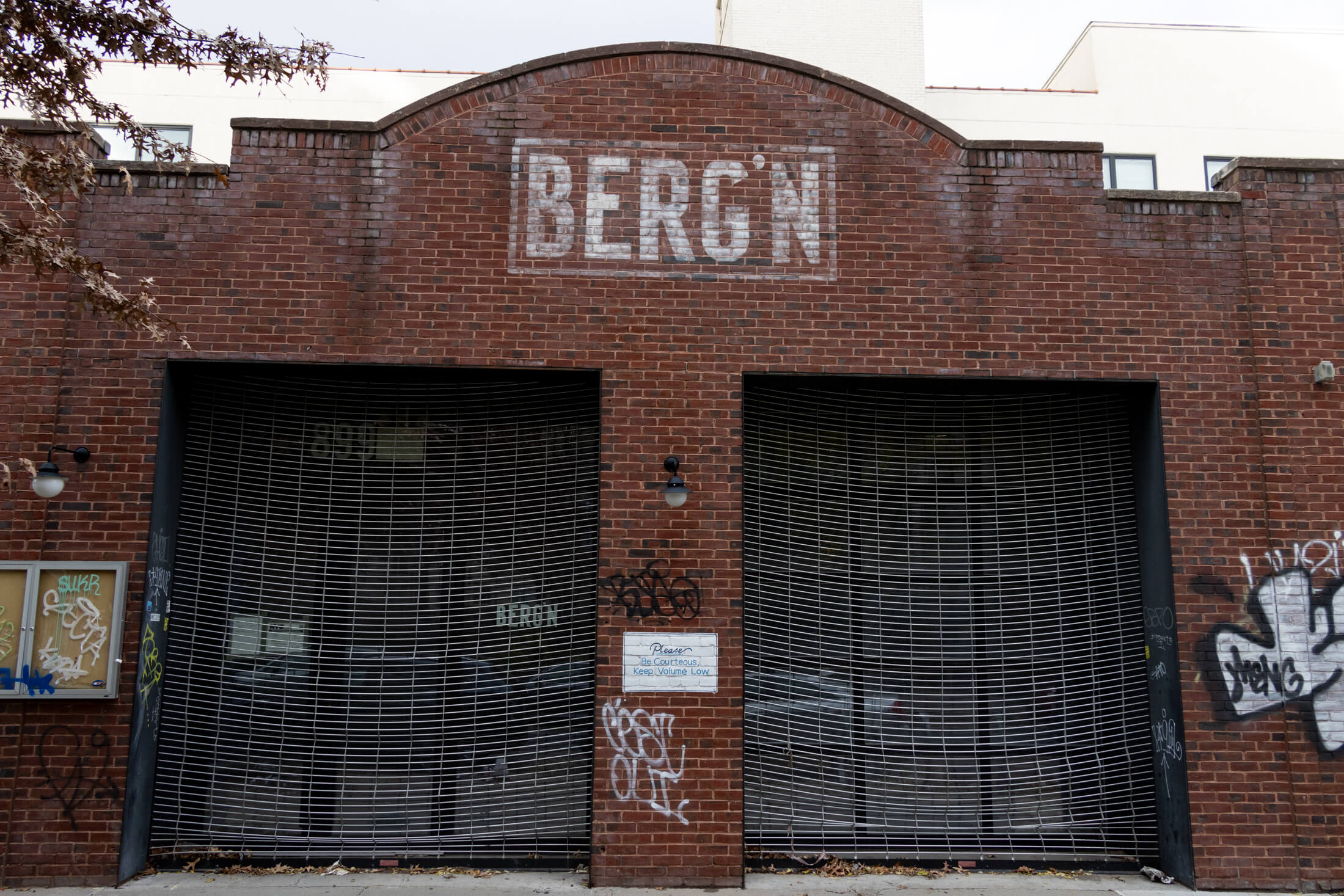 entrance to berg'n with faded sign painted in white